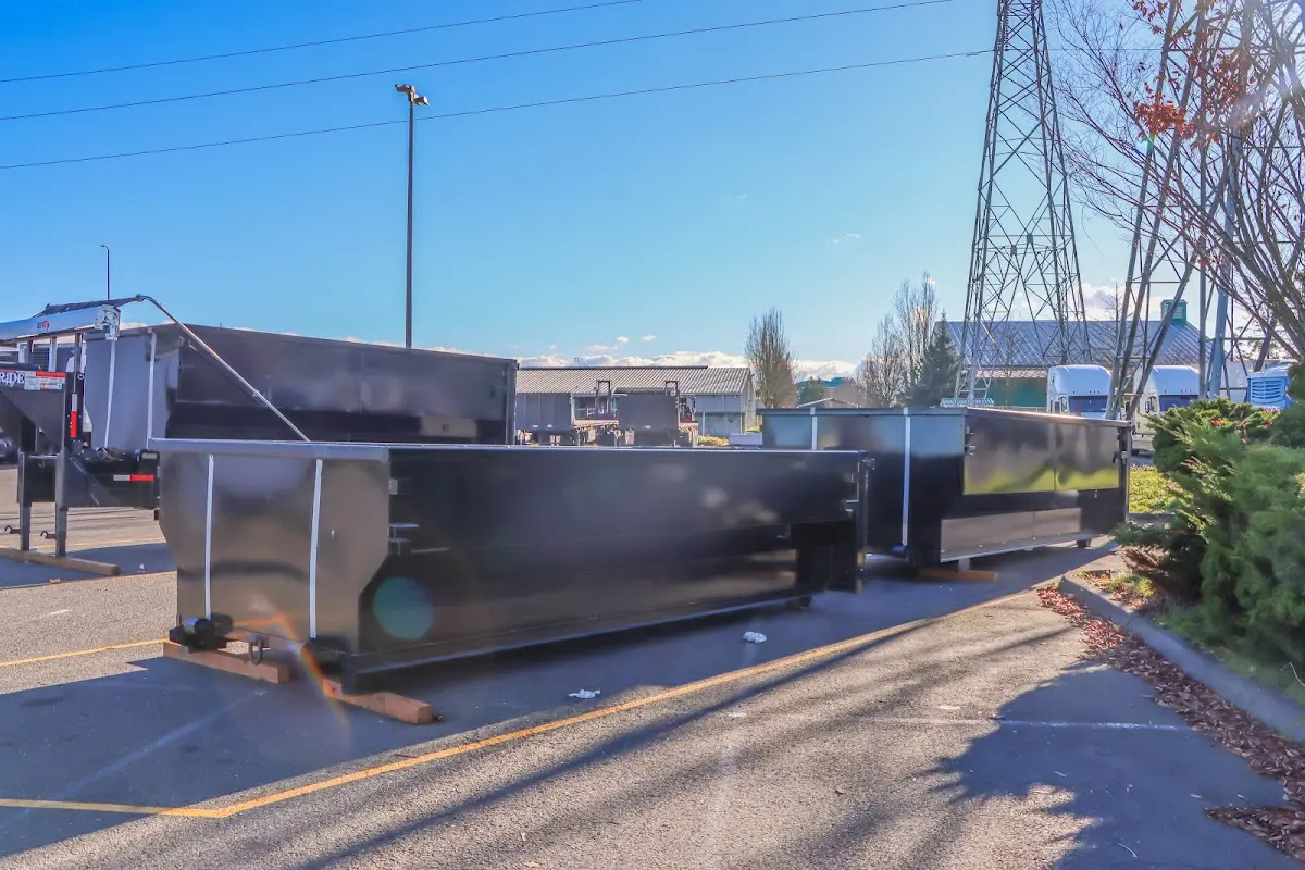 Roll-off dumpster ready for waste disposal at job site for Roll Off Dumpster Rental in Adams